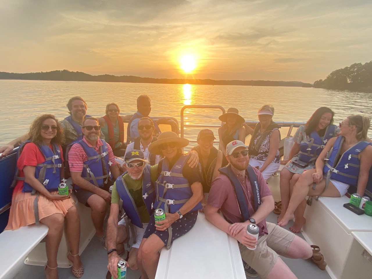 Group of people smiling on a boat.